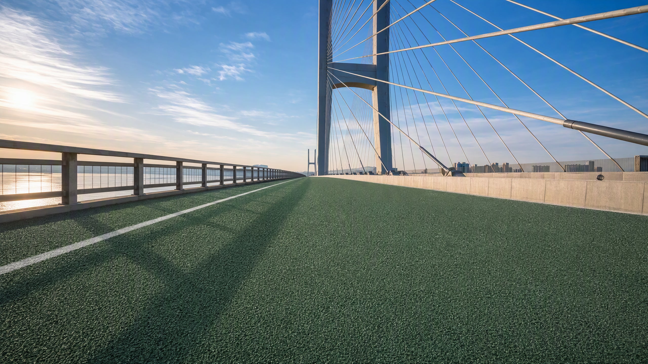 All-weather colored surfacing for bridges and tunnels